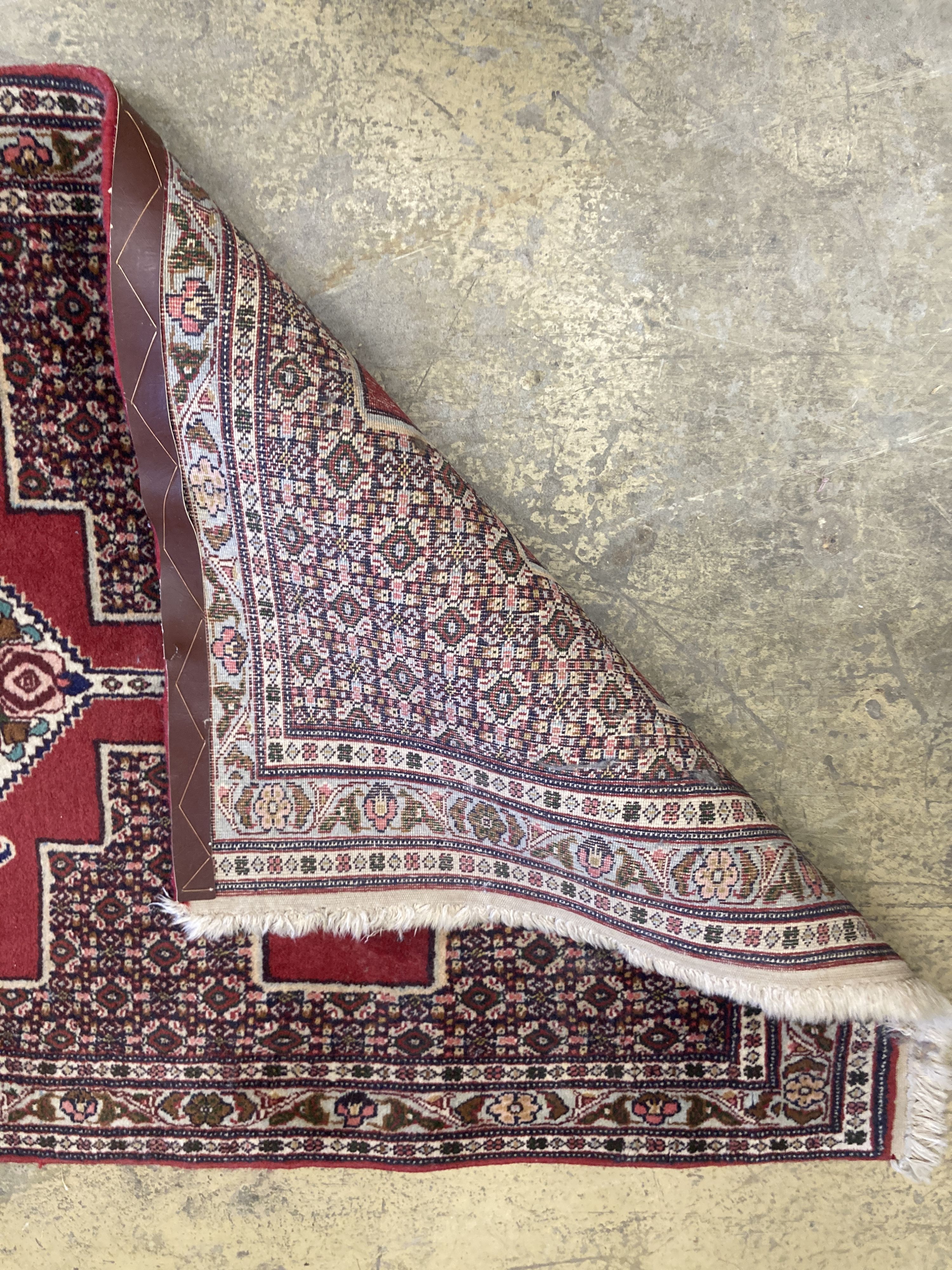 A North West Persian red ground runner, 380 x 94cm